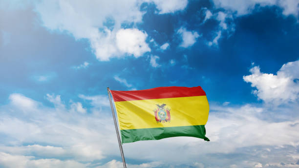 istock flag of bolivia on blue sky background 1949561745