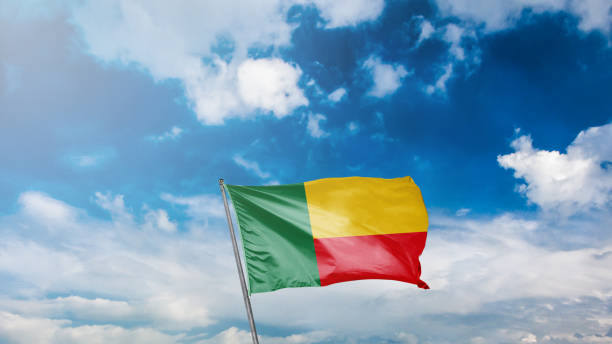 istock flag of benin  on blue sky background 1949561749