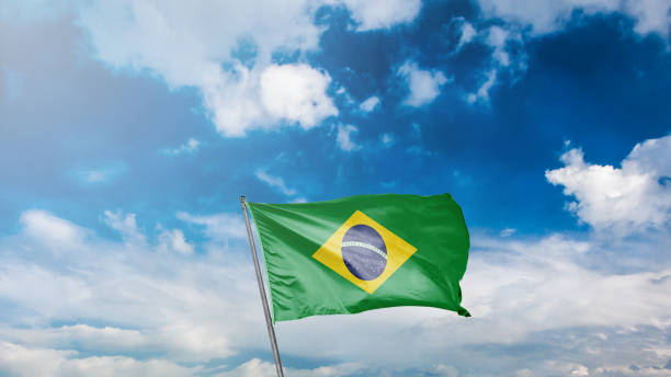 istock flag of brasil on blue sky background 1949562812