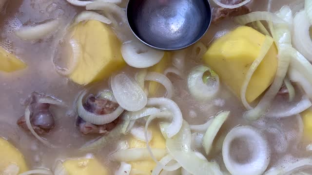 Delicious potato and meat meal in boiling sauce. The pair is rises stock video
