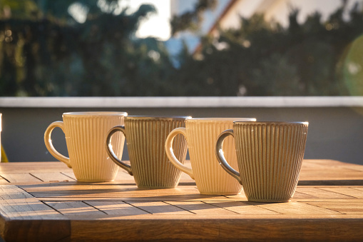 Photo of the set of four cups in sunset light