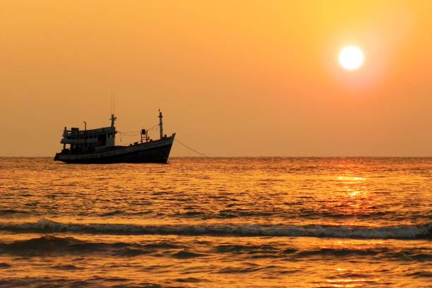 istock Sunset river boat silhouette view. River boat sunset landscape 1949578778
