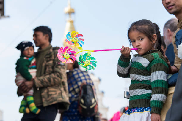 Kathmandu, Nepal- April 20,2023 : People visit the ancient stupas of Swayambhunath temple high above Kathmandu.