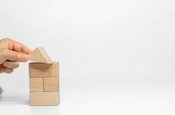 istock building wood blocks on white background; business or creative concept 1949588179