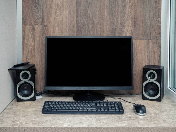 istock Black blank pc monitor stay on desk, around ordered space to work. 1949598844