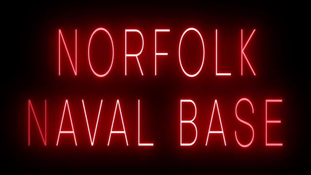 Glowing and blinking red retro neon sign for NORFOLK NAVAL BASE