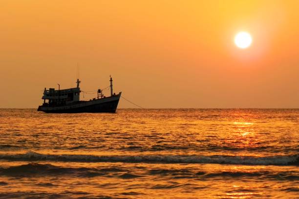 istock Sunset river boat silhouette view. River boat sunset landscape 1949617950