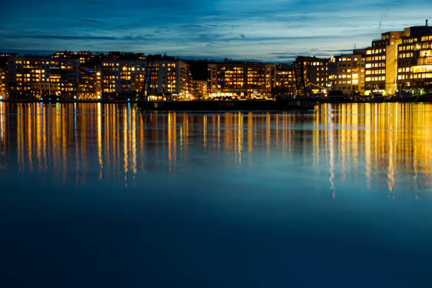a river with a city in the background at night