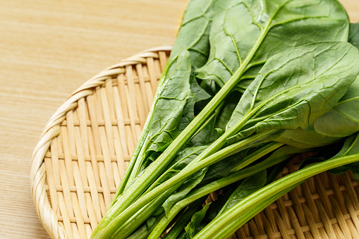 Fresh spinach on wooden table