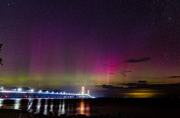 The Aurora Borealis dances above the Mackinaw Bridge