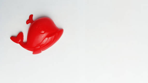 istock children's toy red whale on a white background 1949744946