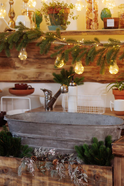 istock Rustic Christmas display with metal tub and greenery 1949760892