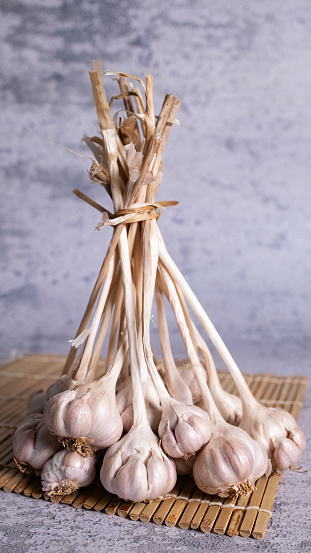 Dried Thai garlic is tied with a whole cork.