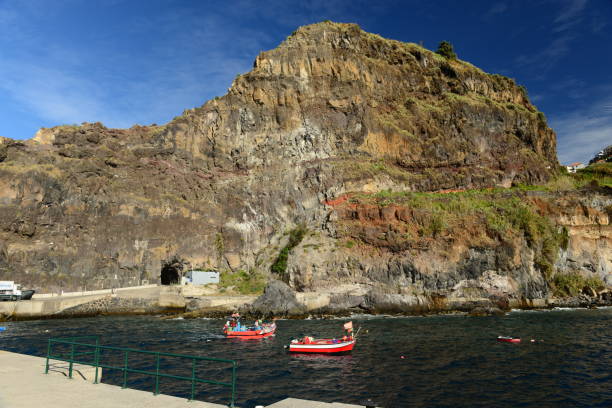 Rugged coast and port of the small village.