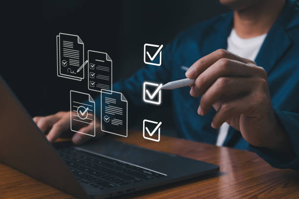 istock Checklist concept, Businessman mark checkboxes, Survey form, check marks on checklist, filling online form and answering questions. List options business employee security procedures followed office. 1949855326