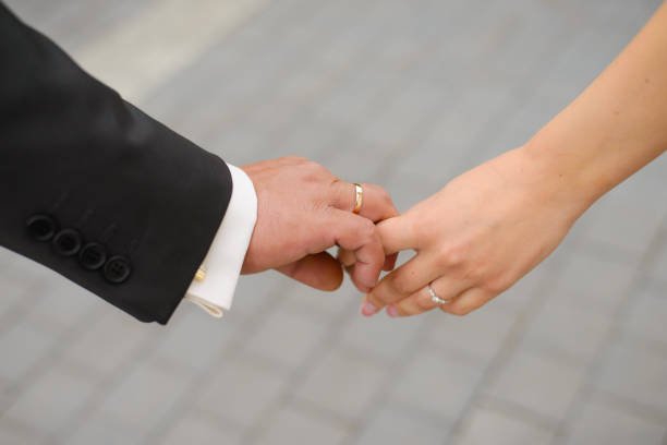 istock The bride and groom hold each other's hands 1949871626