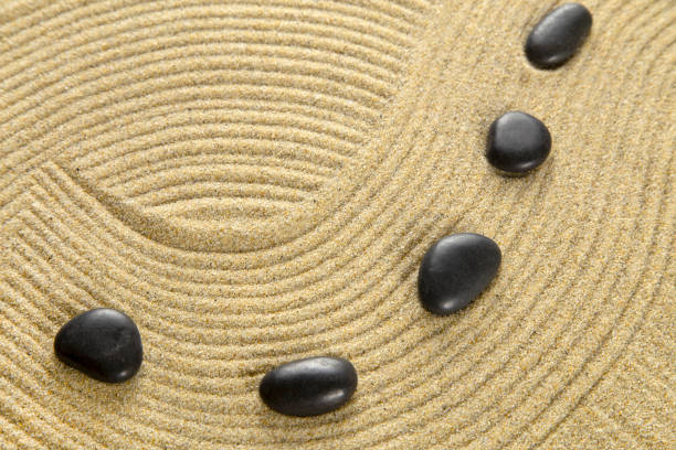 Zen garden Zen garden with the stones and sand pattern spiral rock stock pictures, royalty-free photos & images