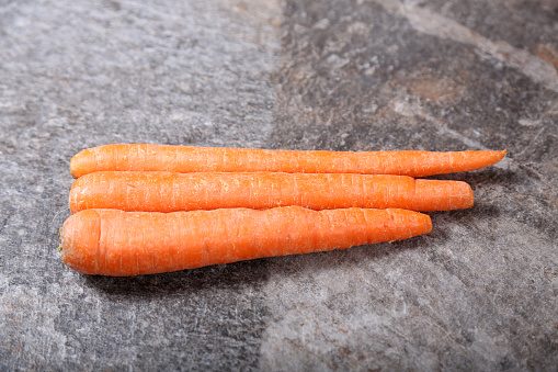 Heap of carrots isolated on a white background