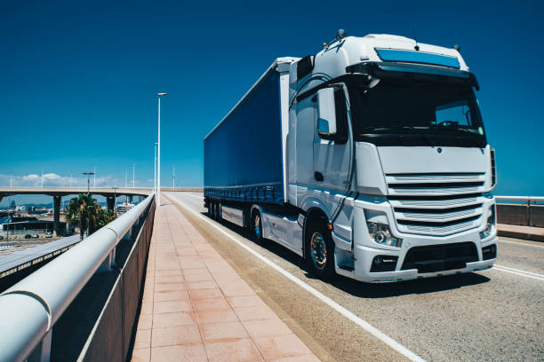 istock Truck driving on bridge on a sunny summer day 1949899059
