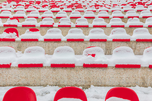 Stadium seats covered with snow in January