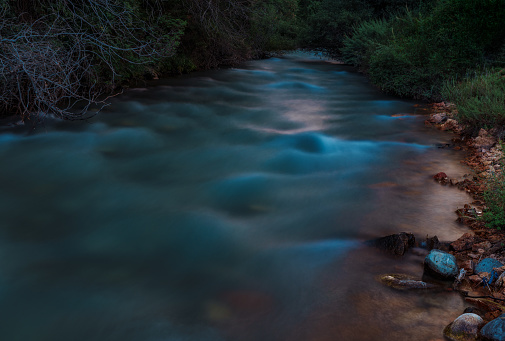 Mountain river in the evening, blurred motion effect