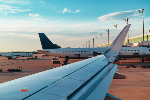 istock Passenger airplane on the runway at summer day 1949906133