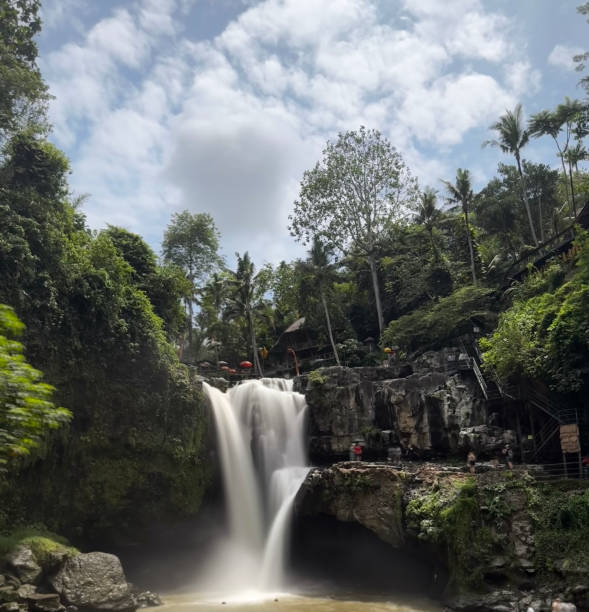 istock a waterfall surrounded by trees and natural landscape. 1949914611
