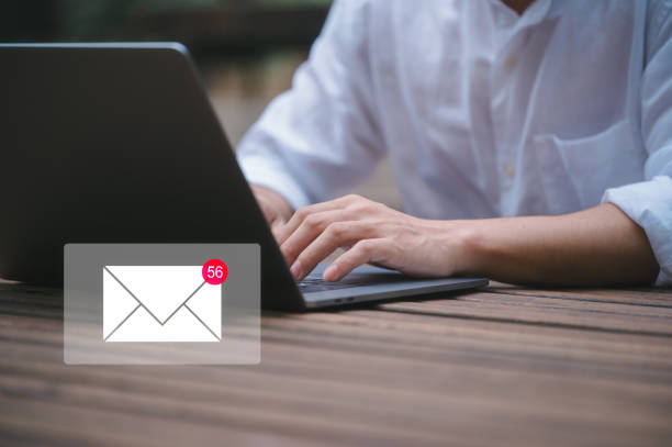 istock businessman sitting outdoor using computer laptop typing or writing email in concept of online marketing and email concept 1949954504