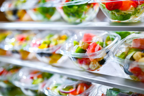 istock Boxes with fruit and vegetable salads in a commercial fridge 1949955560