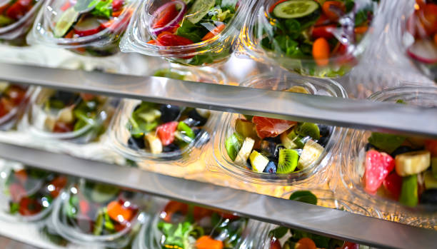 istock Boxes with fruit and vegetable salads in a commercial fridge 1949956094