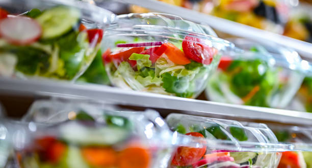 istock Boxes with fruit and vegetable salads in a commercial fridge 1949956629
