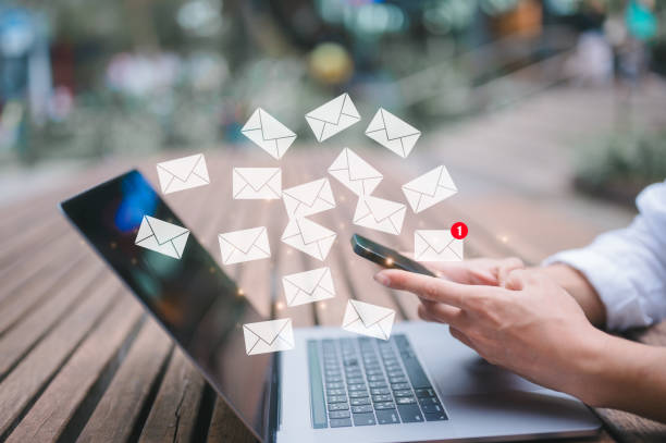 istock businessman sitting outdoor using computer laptop typing or writing email in concept of online marketing and email concept 1949964239