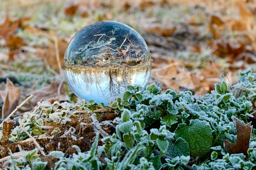 Close up of crystal ball on frozen field