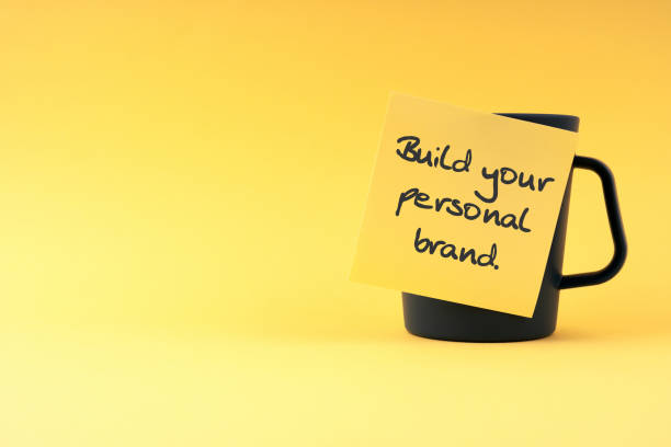 Build your personal brand text on sticky yellow adhesive note