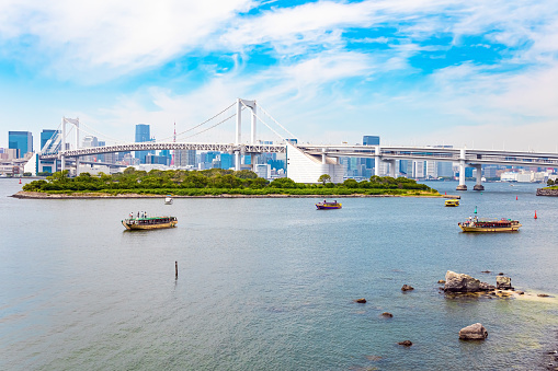 Tokyo Bay. The island Odaiba is connected by the Rainbow Bridge to the center of Tokyo. Japan. Sea trams run along the sea.