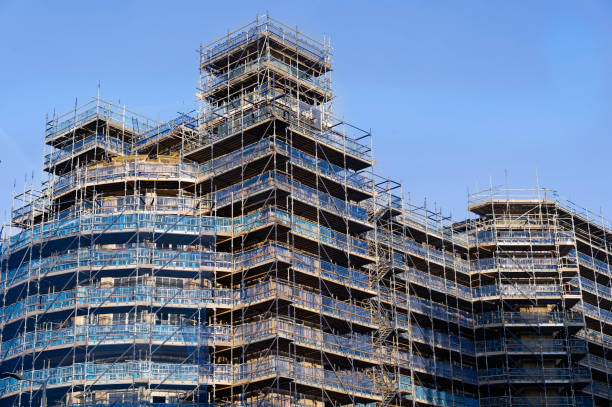 istock Scaffolding surrounding residential development for safe access to construction work 1950026275