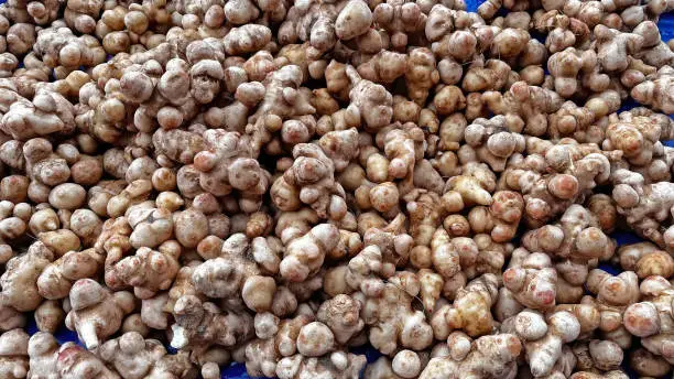 Photo of Yams on the stall at the farmers' market.