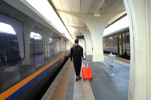 istock male at the train station 1950060400
