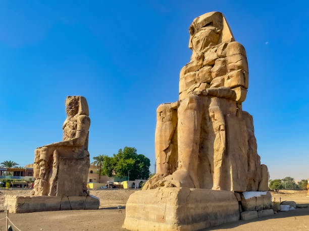 istock Colossi of Memnon, two massive stone statues representing the pharaoh, Luxor, Egypt 1950060937