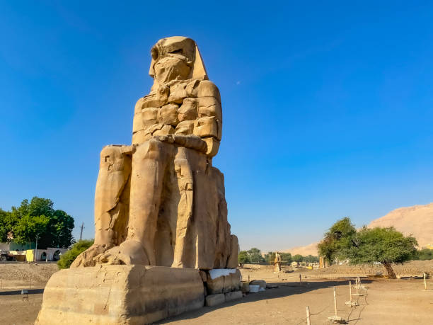 istock Colossi of Memnon, two massive stone statues representing the pharaoh, Luxor, Egypt 1950060968