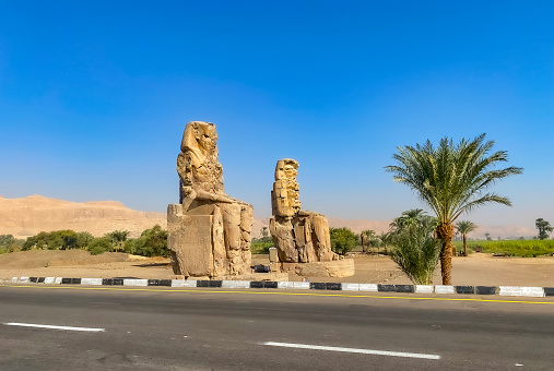 Colossi of Memnon, two massive stone statues representing the pharaoh, Luxor, Egypt.