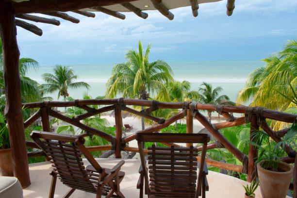 istock Lounge chairs on the balcony overlooking the beach in Holbox Mexico 1950079632