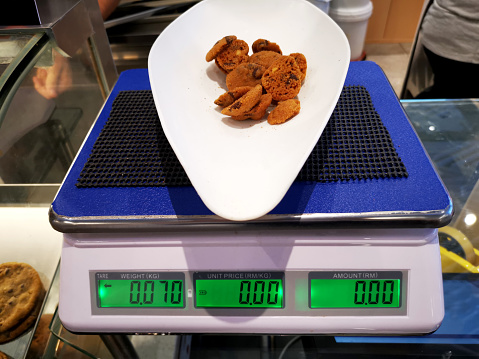 Weighing scale at workplace - cookies in store