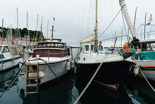 An elegant white cruiser in the cozy marina of Vesteroe Havn on Laesoe island in late August 2016