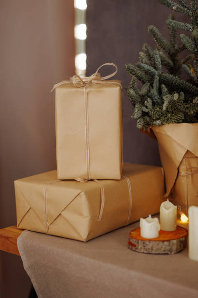 istock Cozy Christmas setting with gifts and candles 1950120409