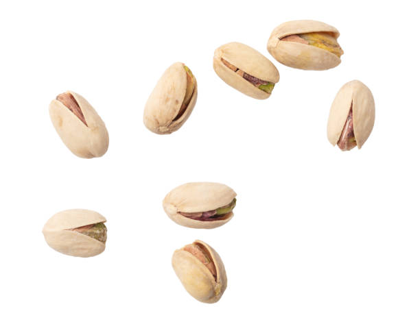 istock Fresh pistachios isolated on white background. Macro 1950124620