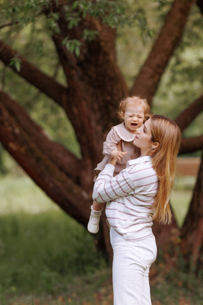 istock Mother hugging pacifying sad upset stressed crying toddler girl. 1950134469