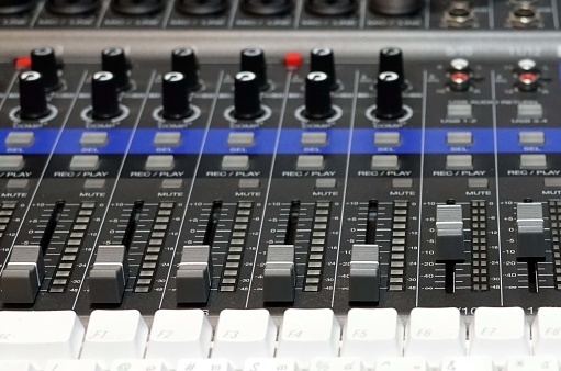 Close-up of the fader of a mixer in the reccordding room.