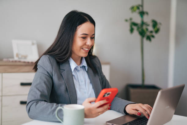 istock Happy young woman is enjoying working from home 1950135518
