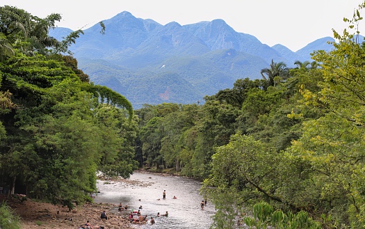 Morretes, Paraná, Brazil, 01.11.2024\nBathers on the Nhundiaquara river and Serra do Mar mountains in the state of Paraná, southern Brazil